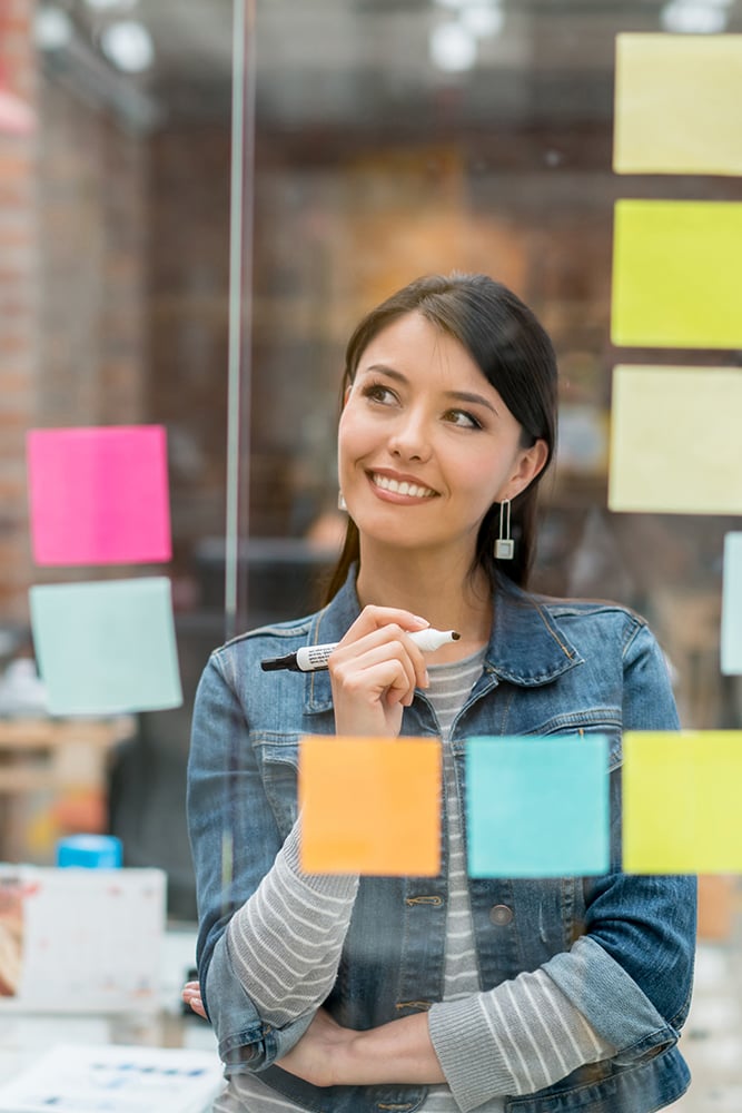 Portrait of a UX designer with post-it notes. Portrait of a UX designer with post-it notes.
