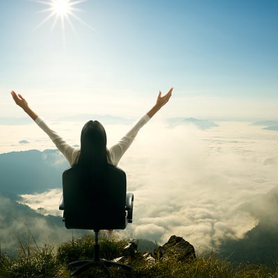 A woman on a chair above the clouds A woman on a chair above the clouds
