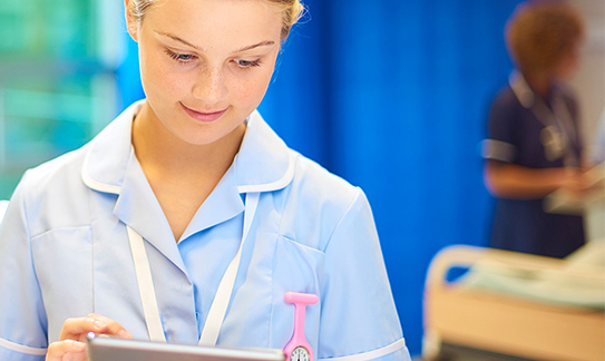 Nurse holding an iPad Nurse holding an iPad