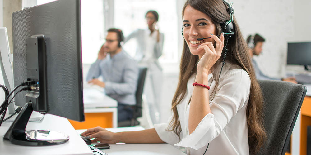 Woman answering calls at a call centre Woman answering calls at a call centre